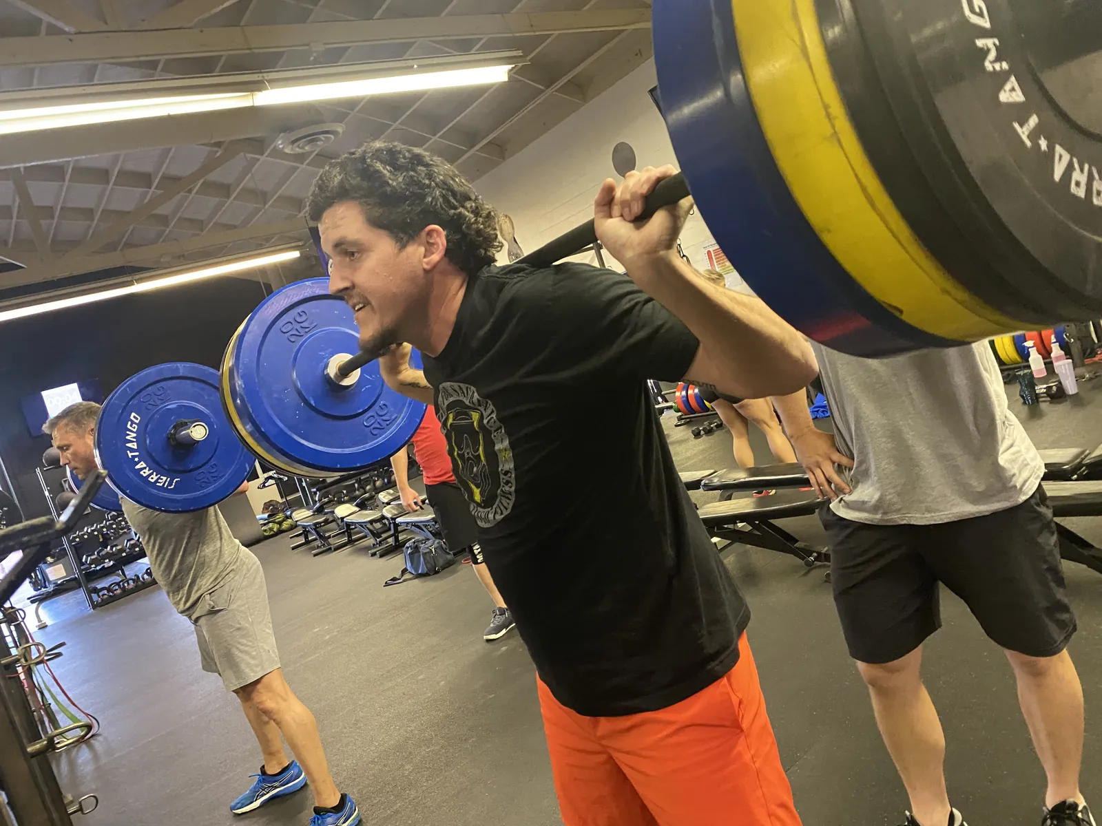 A member back-squatting at Sierra Tango Fitness