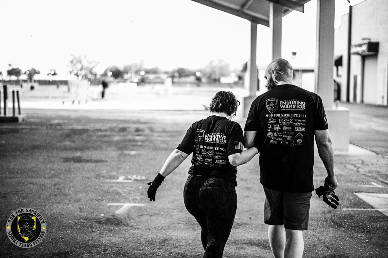 Two members walking together at a Sierra Tango event