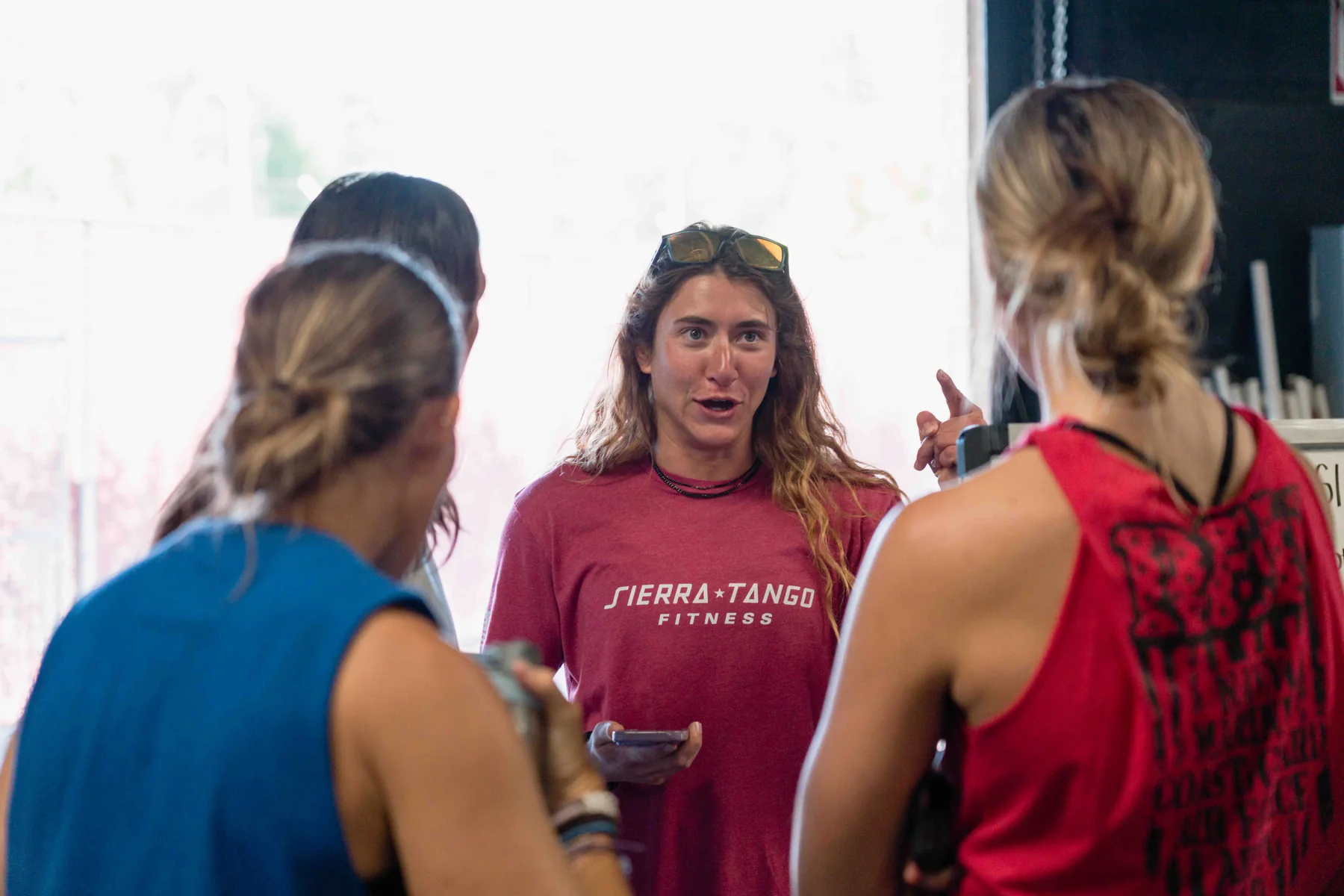 A coach talking one-on-one with a member